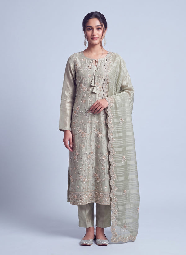 Sage green tissue silk salwar suit with rose vine embroidery, tie-up neckline and striped dupatta, front view