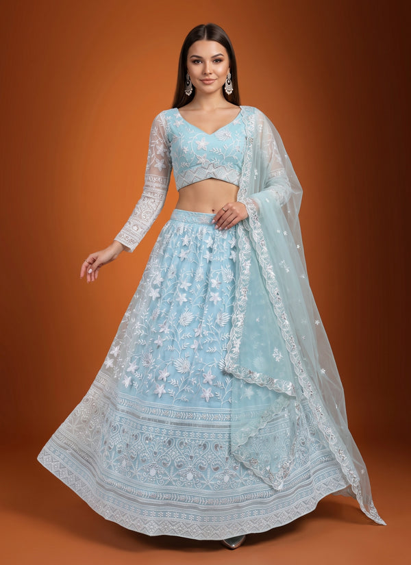 Ice blue net lehenga with white sequin embroidery, sheer sleeve blouse and scalloped dupatta – front view