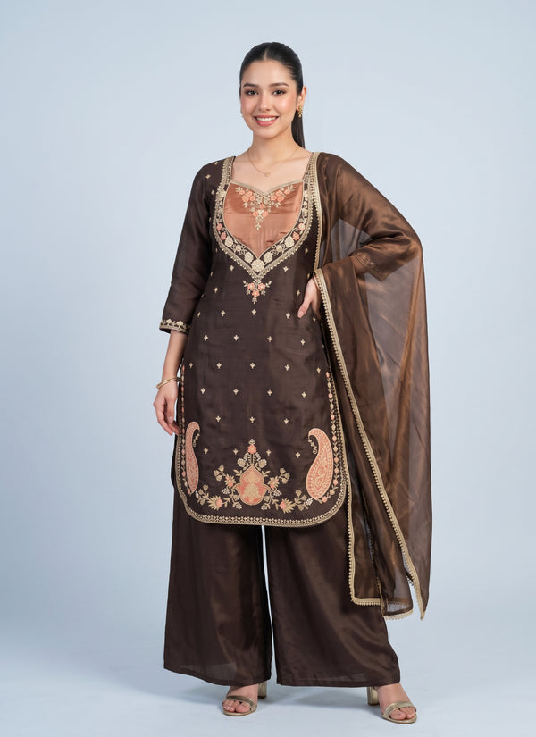 Three-quarter view of the paisley embroidered palazzo suit showing the curved kurti hem and wide palazzo
