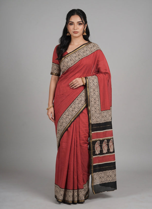 Rust red Maheshwari saree with cream ajrakh geometric border – front view