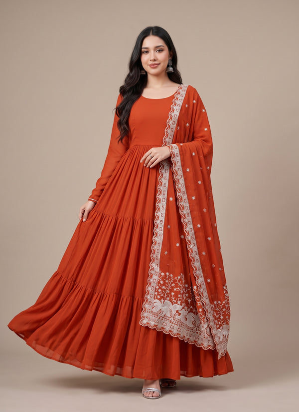 Rust tiered flare gown with peacock embroidered dupatta – front view