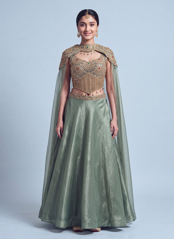 Sage green gabana cape lehenga choli with gold zari stone work blouse, front view