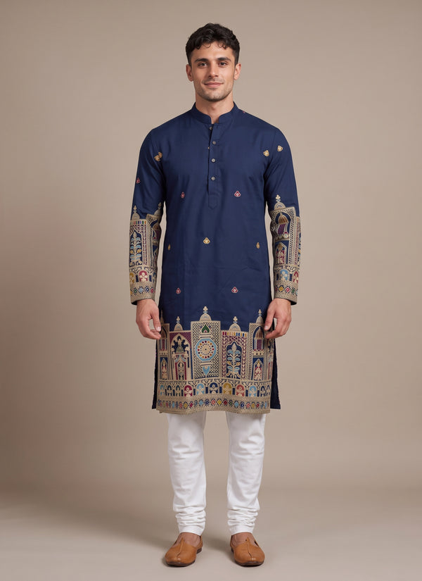 Man wearing a navy blue heavy embroidery kurta pajama for men, front view