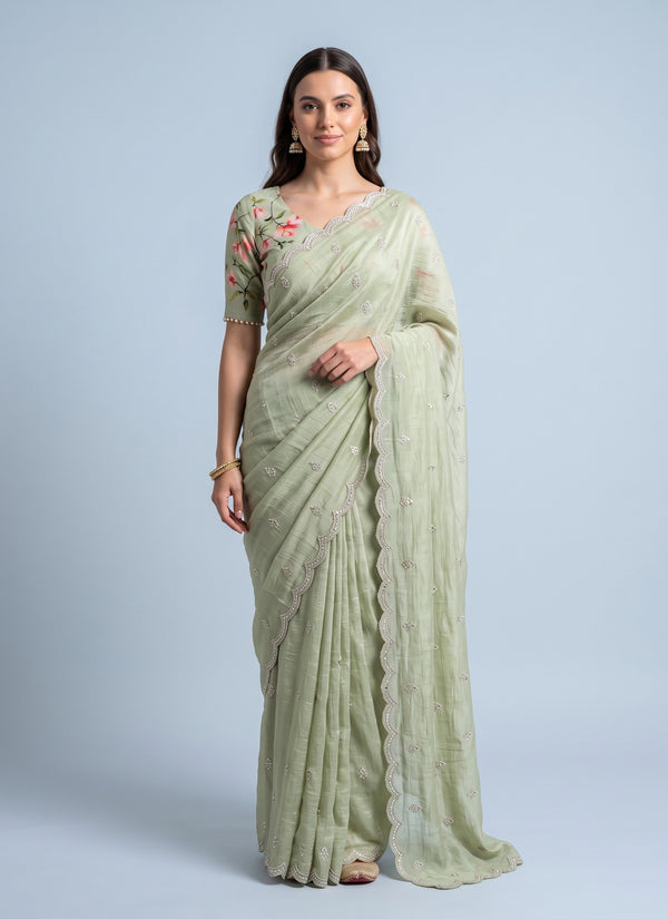 Pista green crush georgette saree with embroidered butti and scalloped border, full length front view