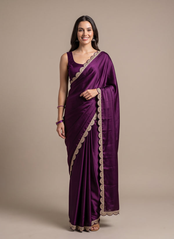 Model in a wine jimmy choo saree with a gold zari scalloped border and sleeveless blouse, front view