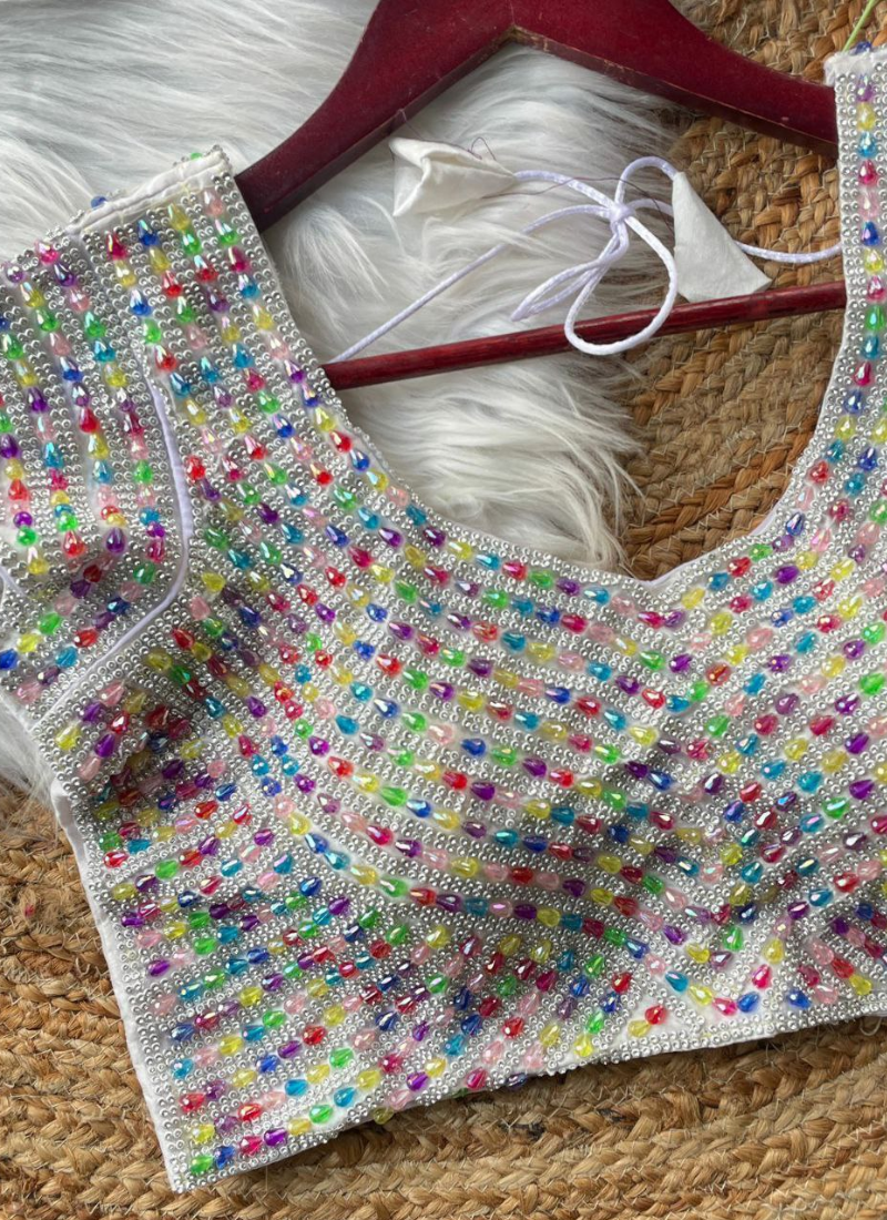 Statement silk blouse with heavy handwork, back hook open style, and traditional detailing.