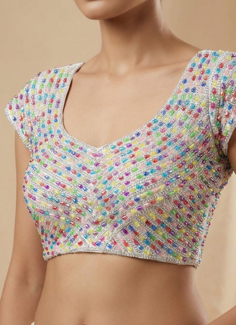 Luxury bridal blouse with handcrafted pearl and bead detailing, padded fit, and cotton lining.