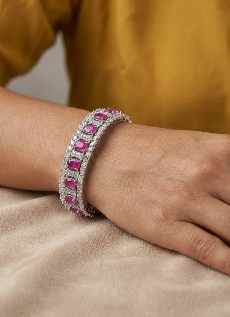 Diamond cut necklace and earring set with premium blue stone centerpiece, bridal jewelry in silver finish.