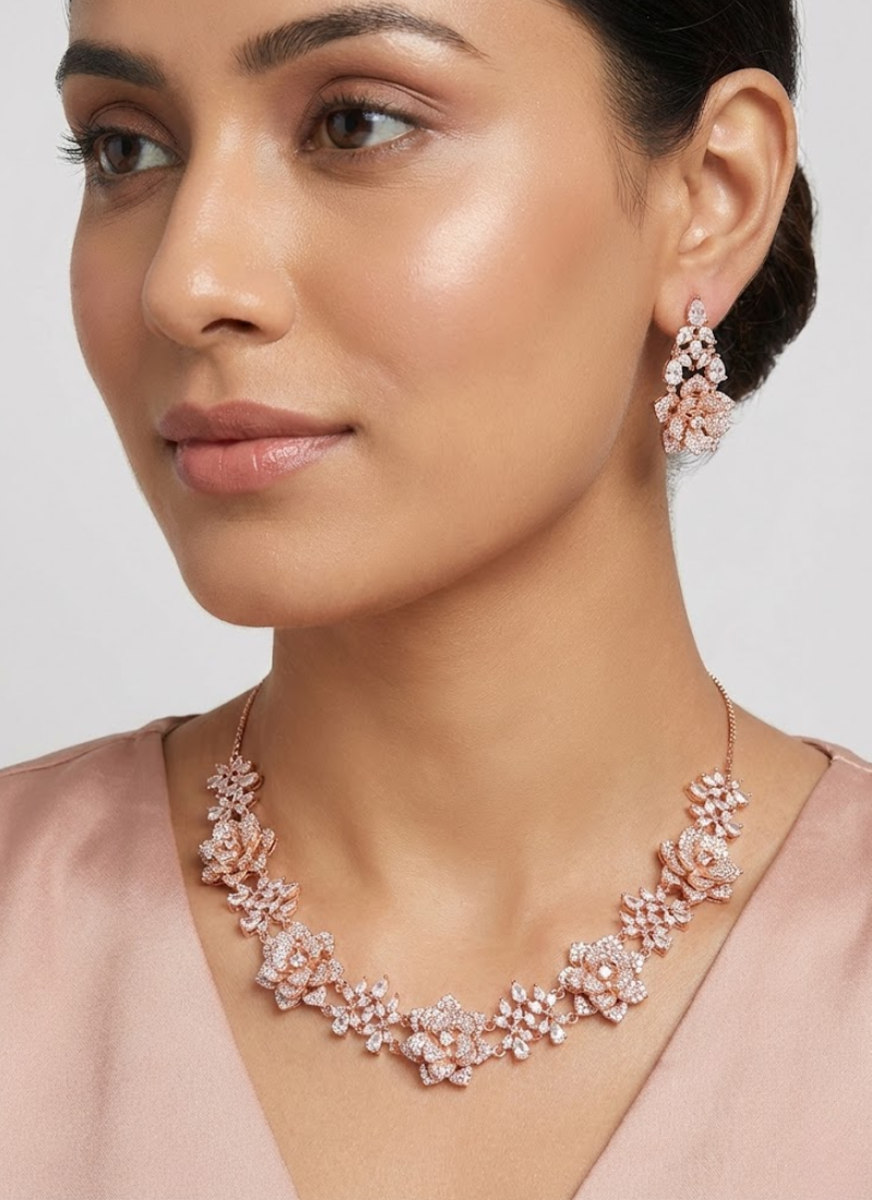 Diamond cut necklace and earring set in rose gold finish, bridal jewelry with premium stone setting.