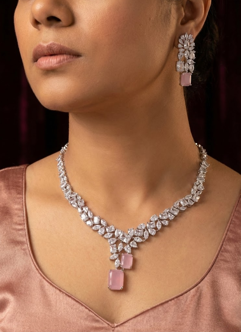 Elegant necklace set with earrings featuring diamond cut stones and pink stone accent, partywear bridal jewelry.