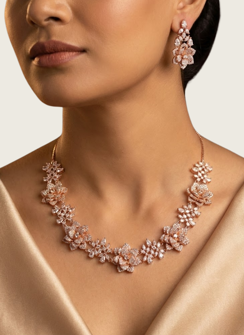 Diamond cut necklace and earring set in rose gold finish, bridal jewelry with premium stone setting.