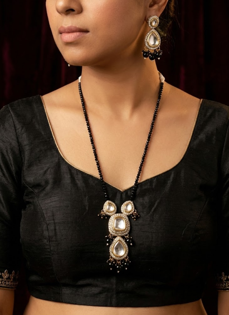 Luxury kundan long necklace with earrings, stone setting and black beads, perfect for weddings and festive occasions.