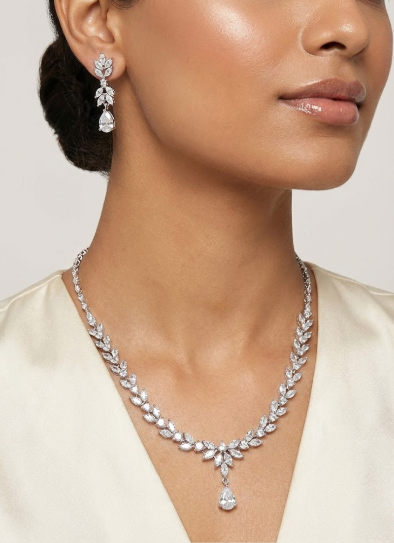 Diamond cut necklace and earring set with premium stone setting, bridal jewelry in silver finish.