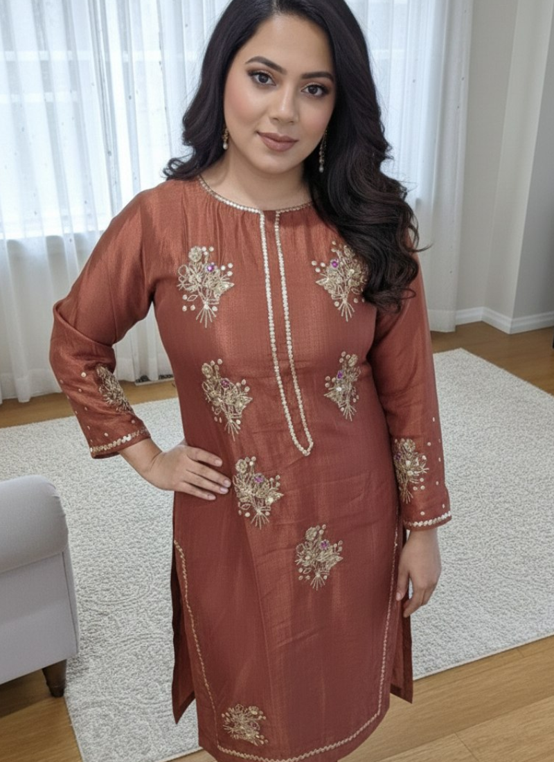 Women’s salwar kameez in silk fabric with zari and sequence detailing, festive partywear design.