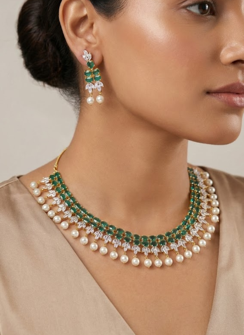 Elegant necklace set with earrings featuring diamond cut stones and green stone accent, partywear bridal jewelry.