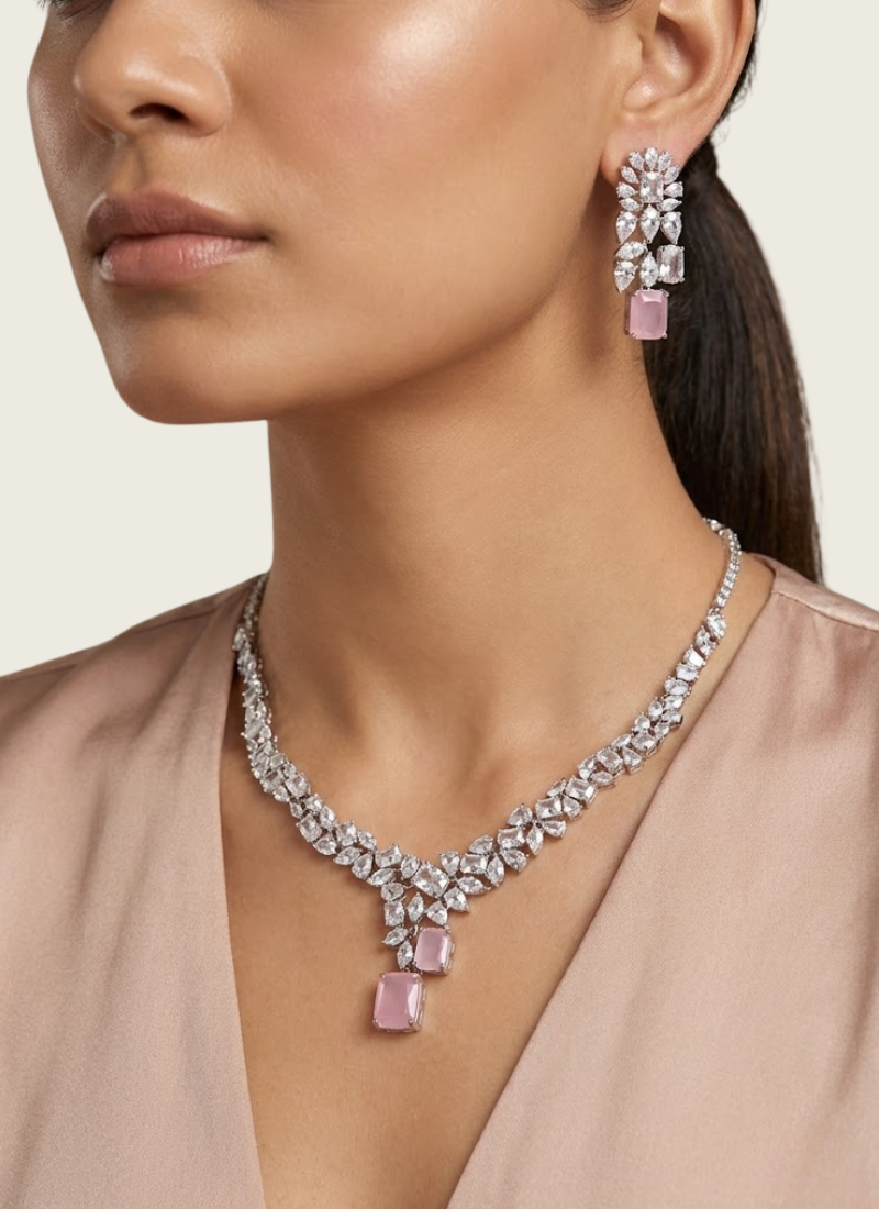 Luxury diamond cut necklace and earring set with high‑quality stone setting and pink gemstone centerpiece.