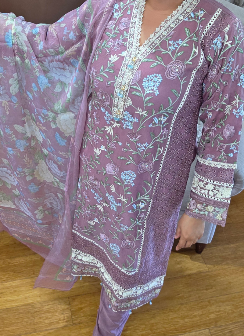 Elegant Indian salwar kameez in light purple chiffon with chikankari detailing and premium embroidery.