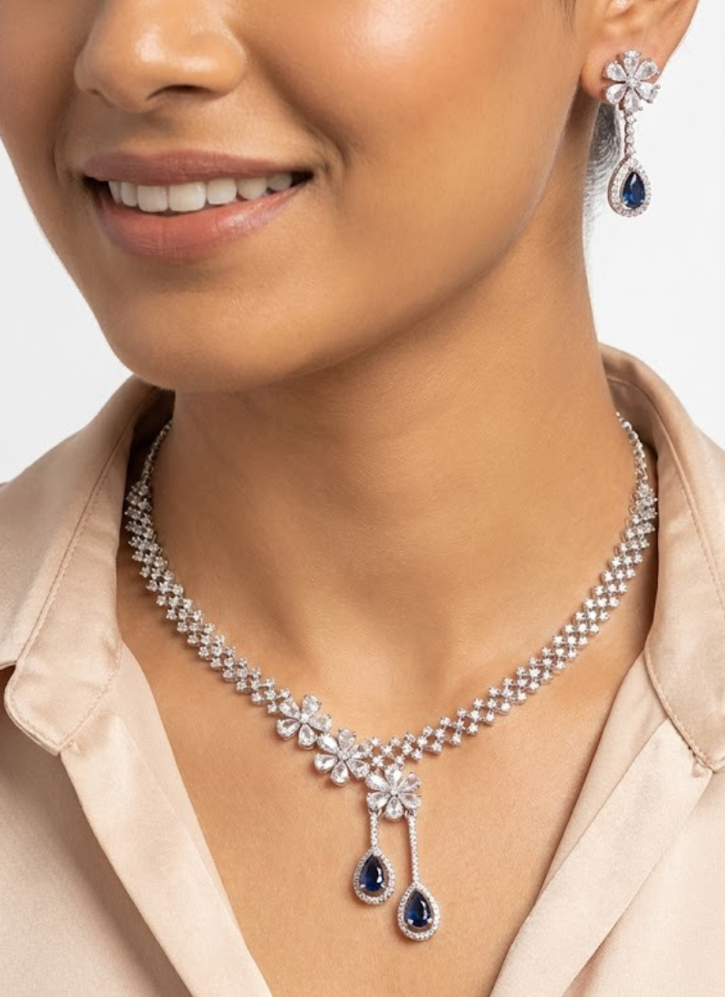 Statement necklace and earring set for women, diamond cut design with premium blue stone, perfect for weddings and parties.