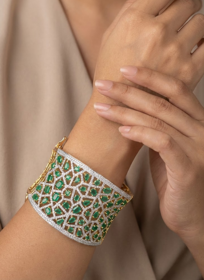 Elegant bracelet design featuring diamond cut stones with green and white setting, partywear jewelry for women.