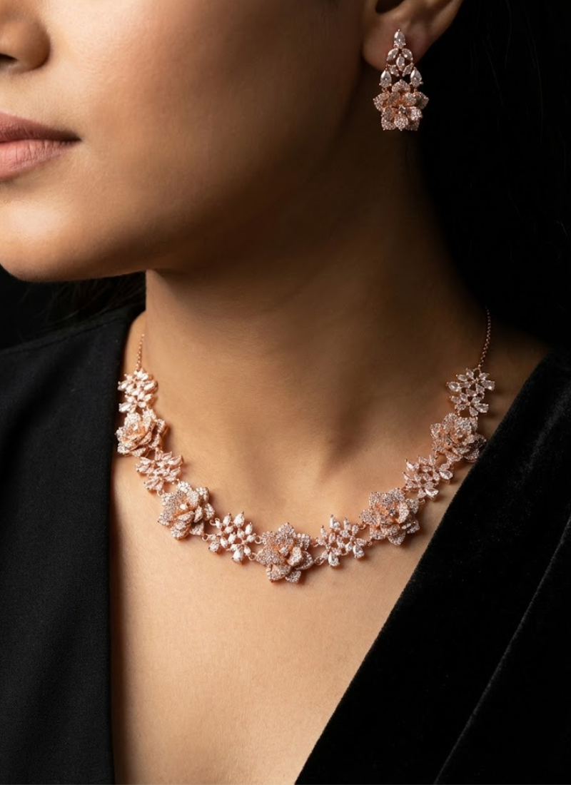 Statement necklace and earring set for women, diamond cut design in rose gold finish, bridal jewelry piece.