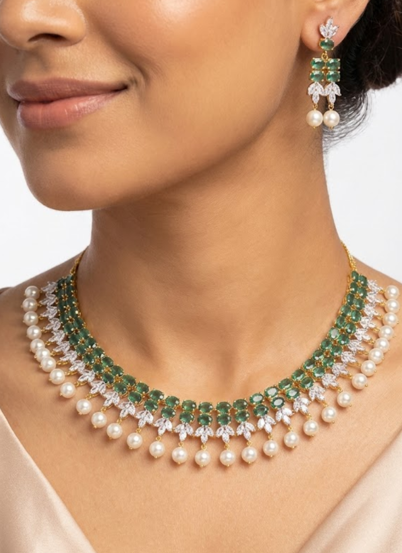 Diamond cut necklace and earring set with premium green stone centerpiece, bridal jewelry in silver finish.