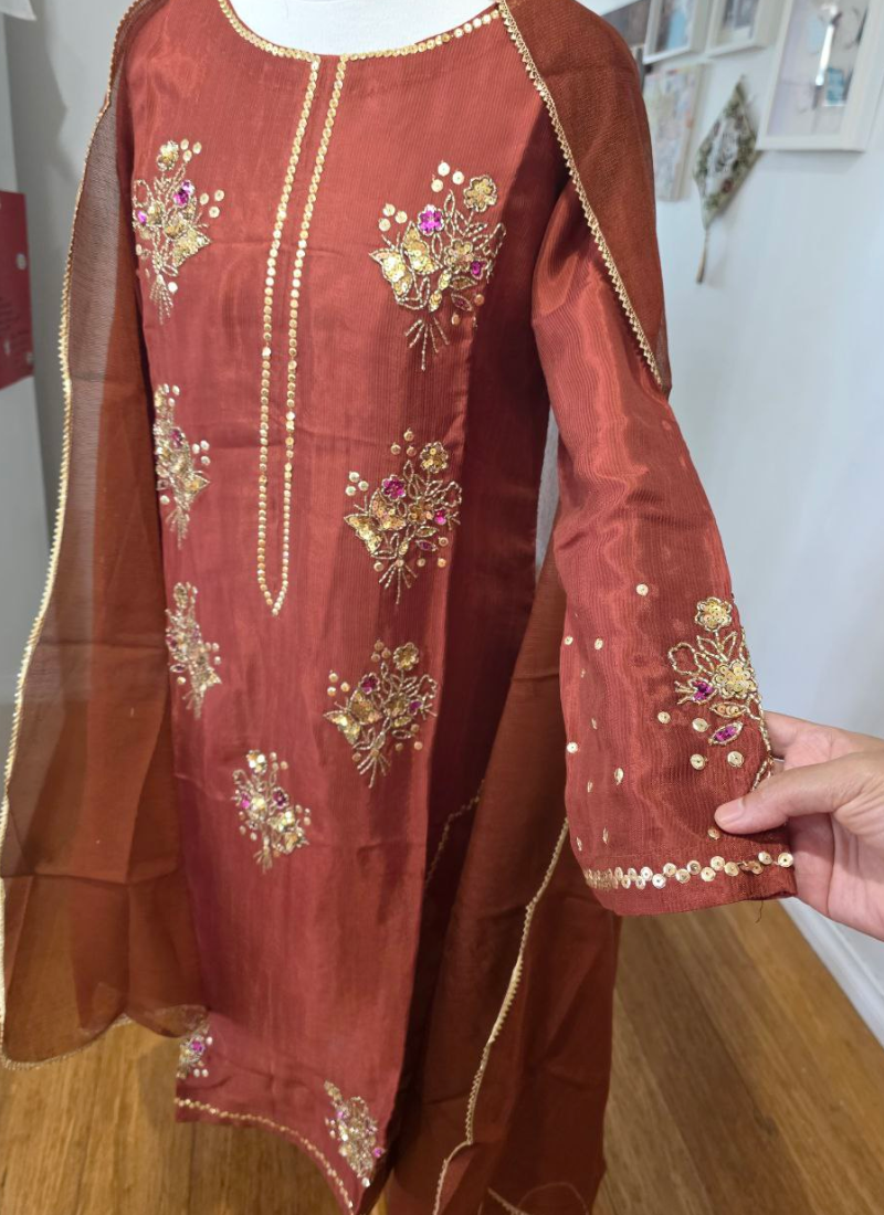 Luxury bridal salwar kameez with silk kameez and salwar, Kota net dupatta, and premium handwork.