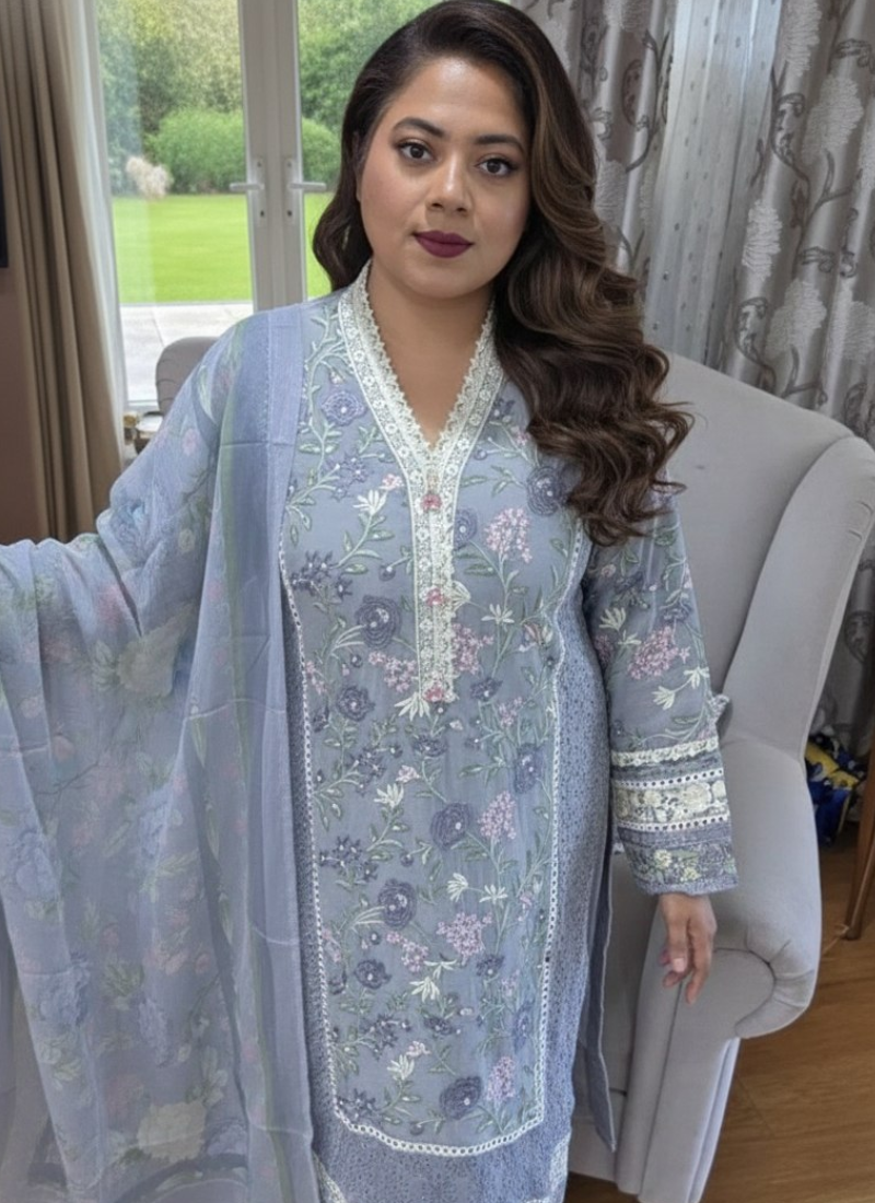 Ash chiffon salwar kameez with satin salwar, georgette dupatta, embroidery, tassels, and lace work.