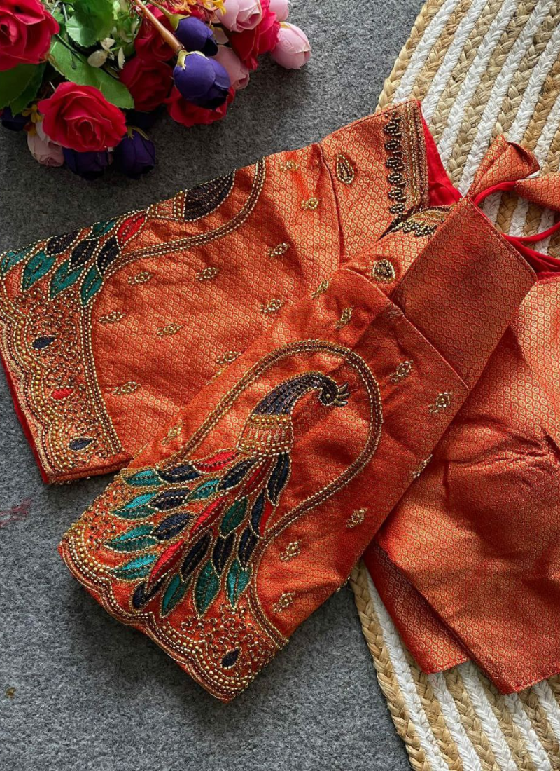 Luxury bridal blouse with Banarasi Jacquard silk, heavy embroidery, padded fit, and cotton lining.