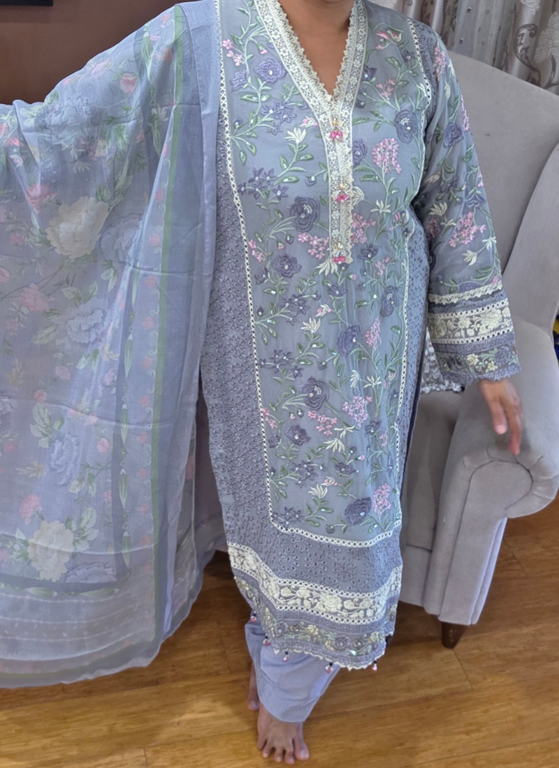 Elegant Indian salwar kameez in ash chiffon with chikankari detailing and premium embroidery.