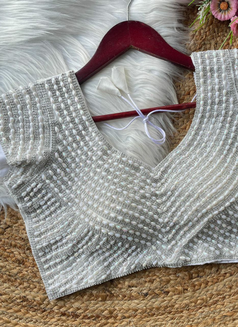 Statement silk blouse with heavy handwork, back hook open style, and traditional detailing.