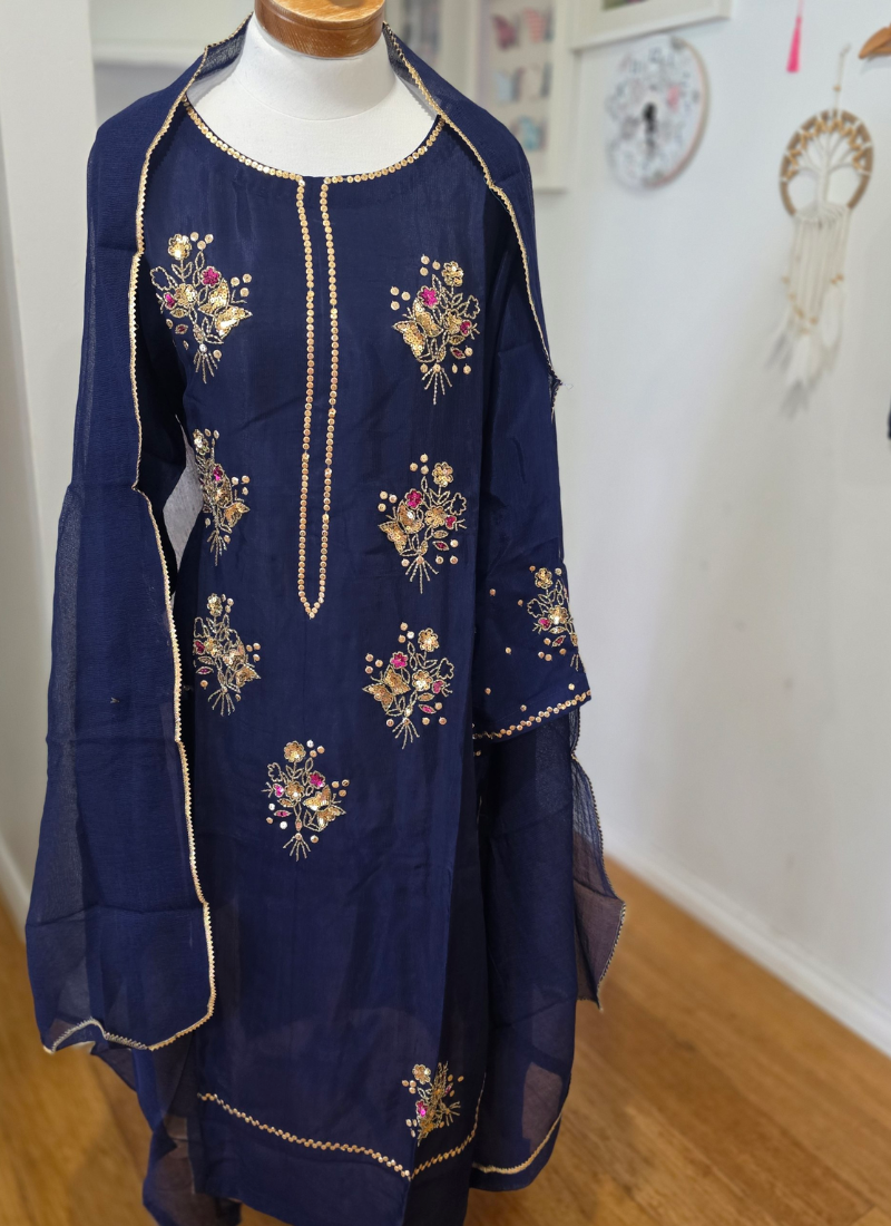 Elegant Indian salwar kameez in navy blue silk fabric, handcrafted embroidery with zari and sequence.