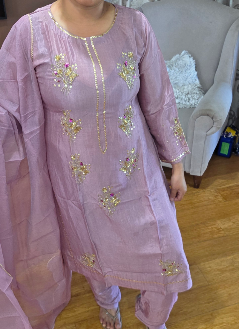 Light onion pink silk salwar kameez suit with zari and sequence handwork, Kota net dupatta, and sleeve detailing.