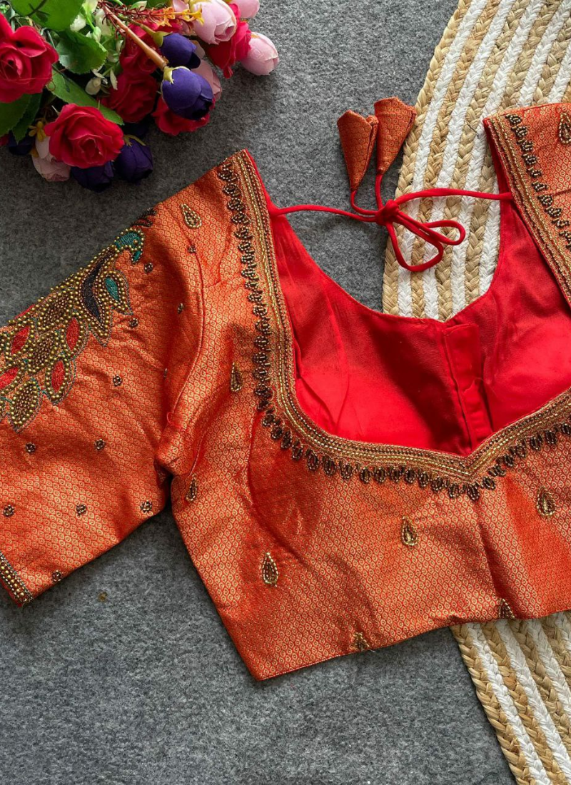 Elegant women’s blouse in Banarasi silk with handmade hooks, latkans, padded fit, and 12 inch sleeves.