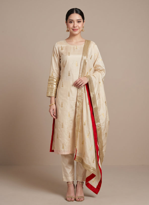 Cream Banarasi silk kurti set with gold buttis and handwork sleeve cuffs – front view