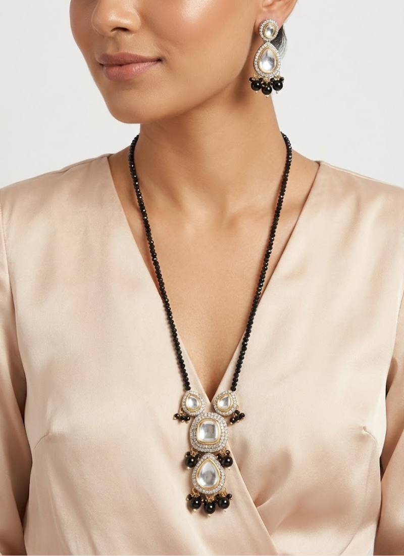 Bridal long necklace set with earrings, kundan artistry and premium stone setting, accented with black beads.