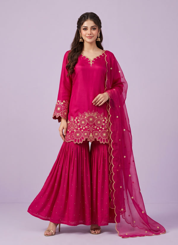 Rani Pink chinon silk sharara suit with gold cut-work embroidery and organza dupatta - front