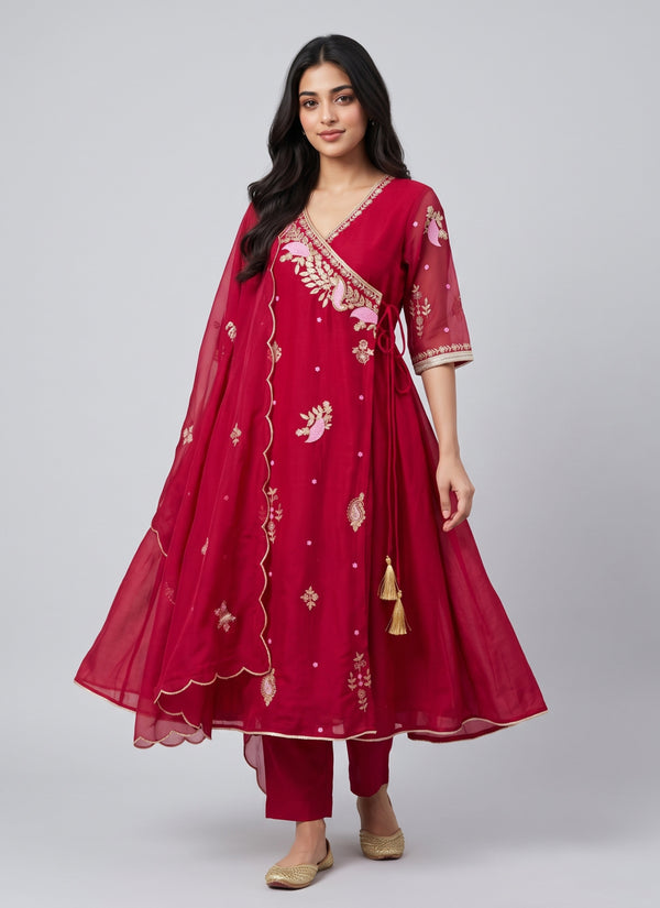 Raspberry red mul chanderi angrakha palazzo suit with flared wrap kurti, elbow sleeves with gold lace, side tie tassels and scalloped dupatta, front view