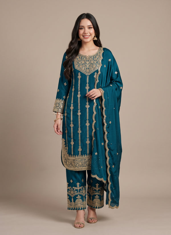 Teal blue sequin embroidered palazzo suit in chinon silk with rounded kurti hem and lace dupatta – front view